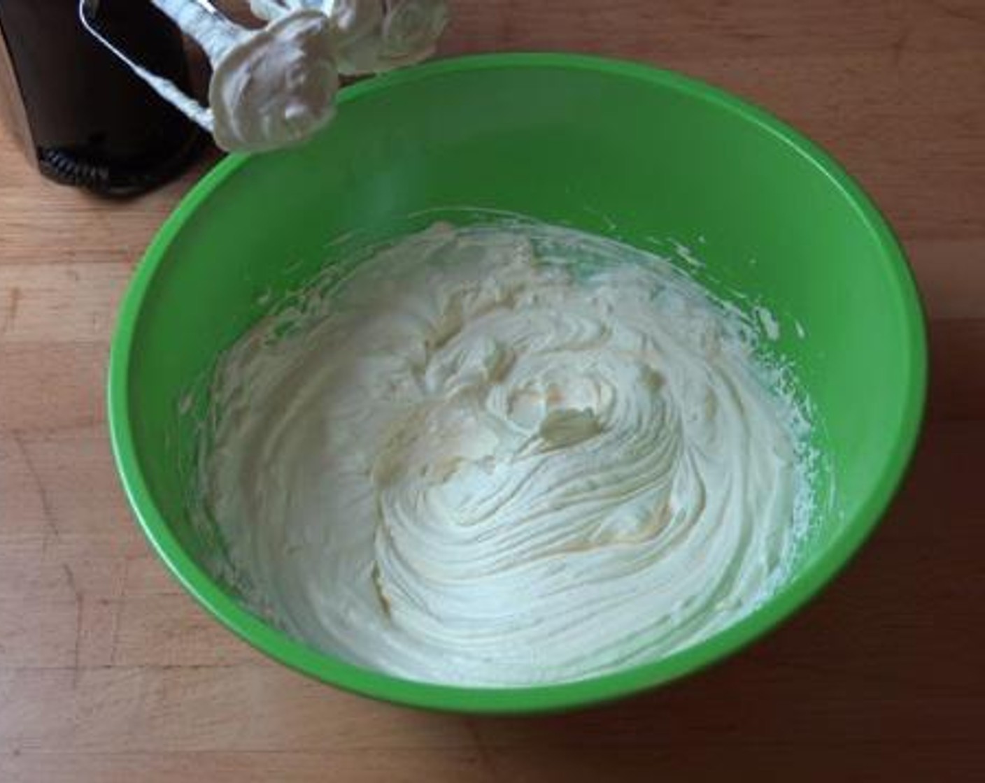 step 3 In a separate mixing bowl, add the remaining cup of whipping cream, and using a hand mixer, beat up the cream until it has soft and nice texture.