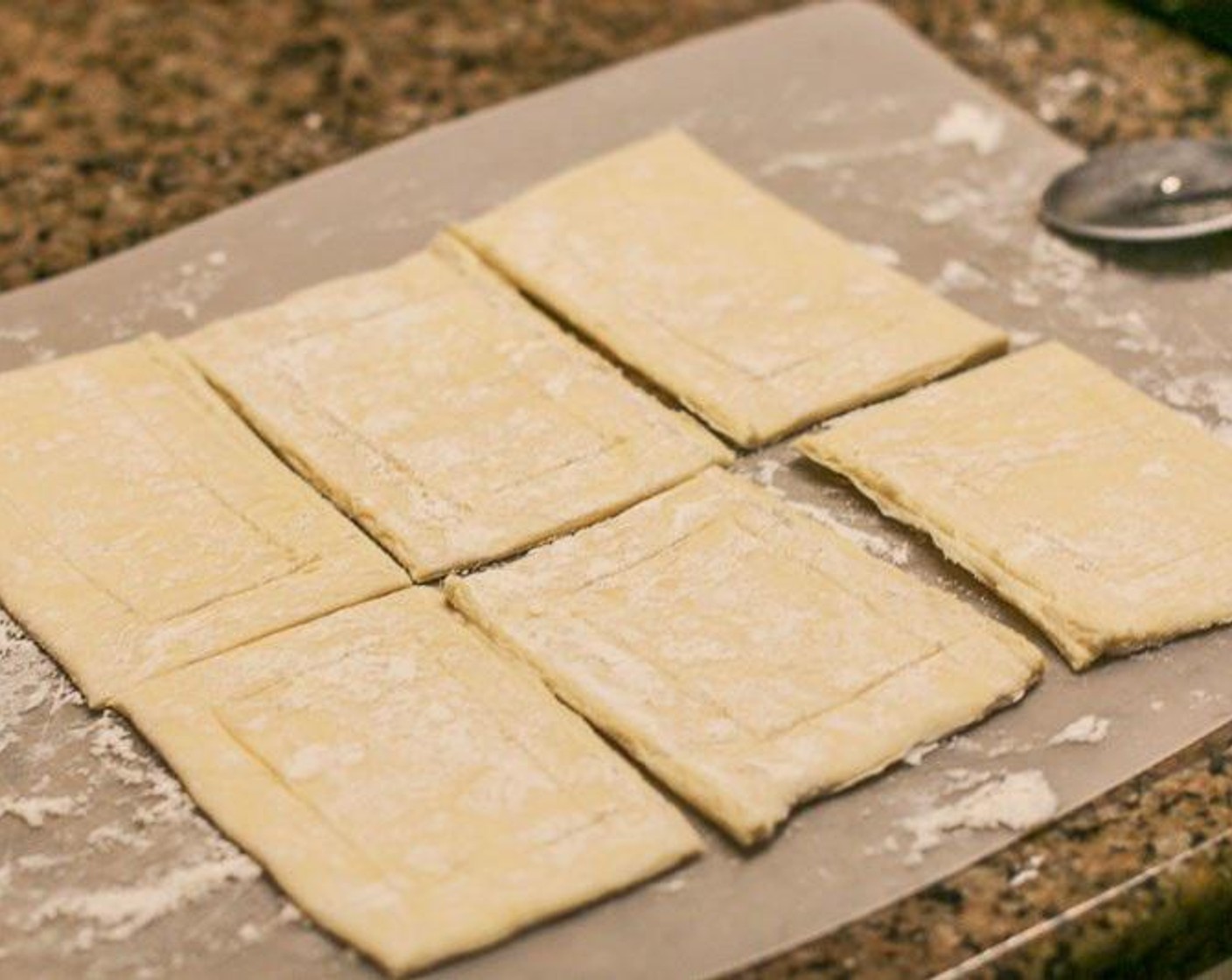 step 4 Roll Puff Pastry Sheets out on a lightly floured cookie sheet. Use a pizza cutter to cut each sheet into thirds vertically and then halves horizontally. Lightly score a rectangle in each puff pastry slice.