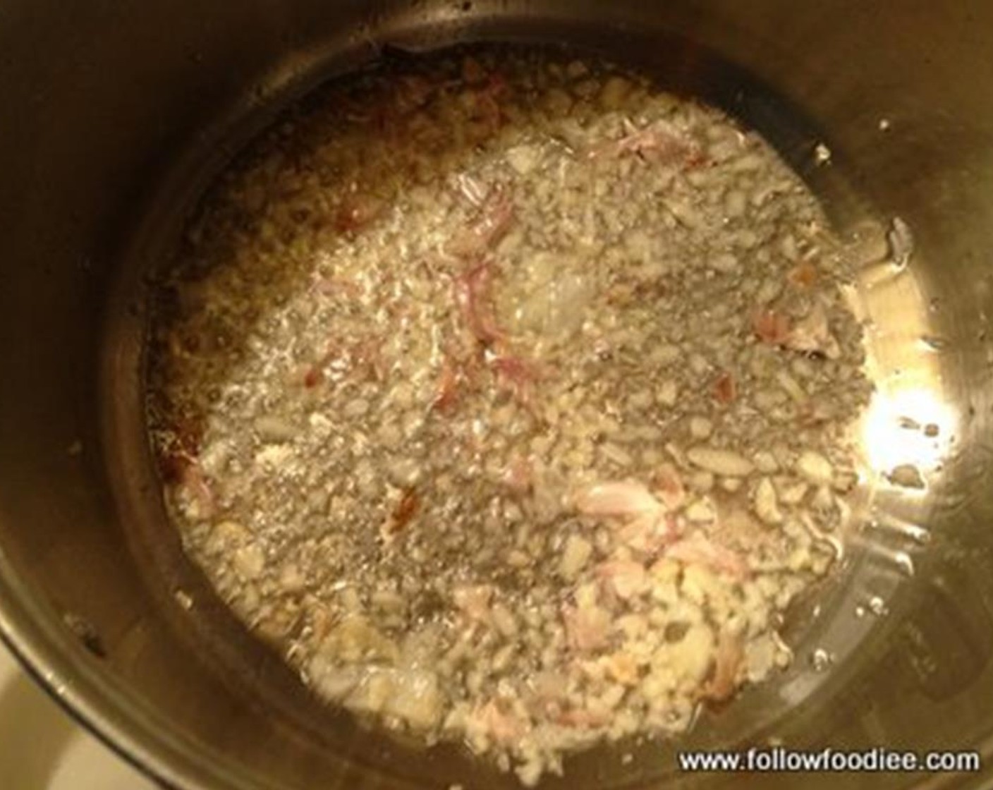step 1 Heat Oil (1 Tbsp) in a heavy bottom pan. Add the Garlic (2 cloves) and sauté for a few seconds.
