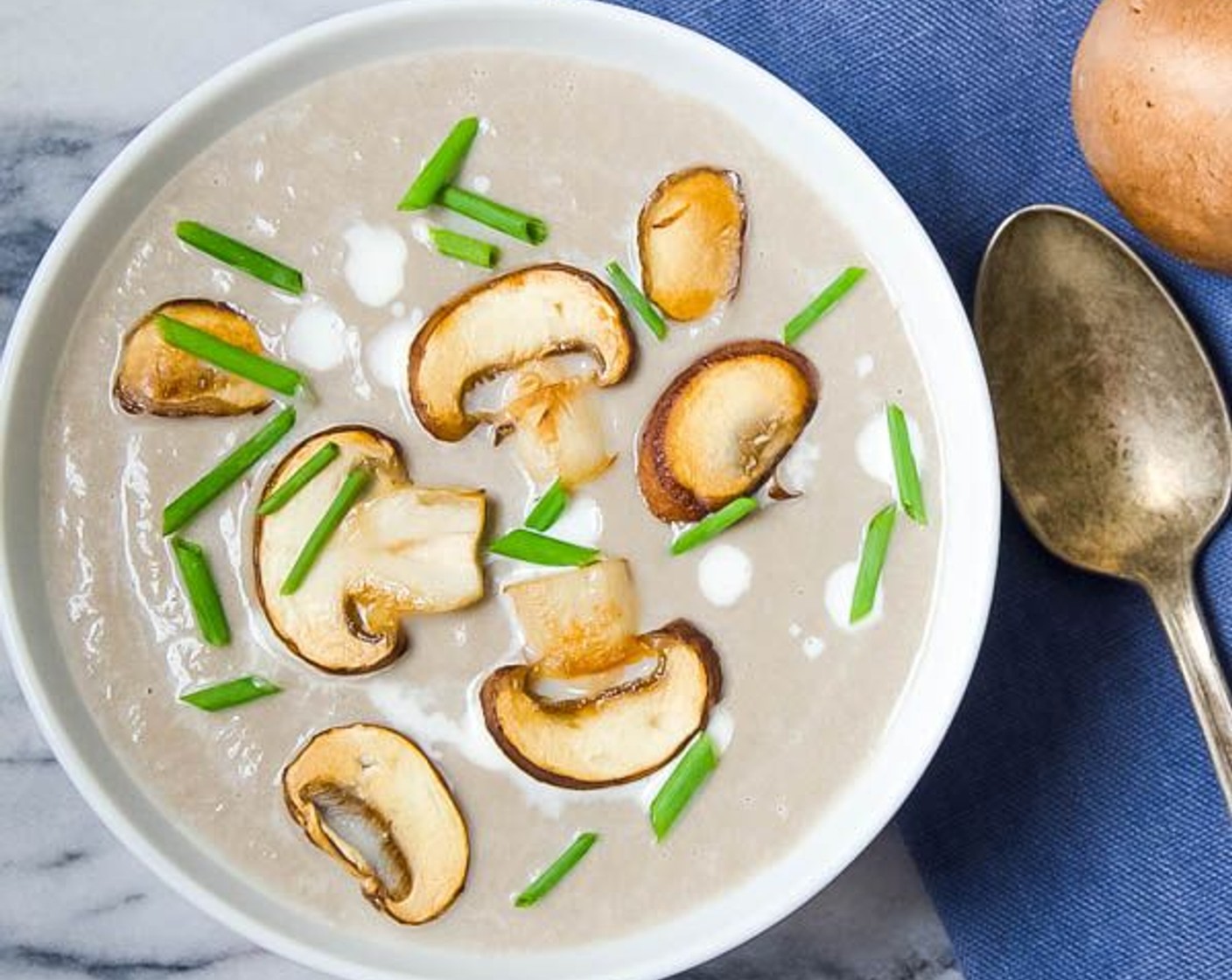 step 9 Chop the Fresh Chives (to taste). Slice the Cremini Mushrooms (to taste) and sauté. Reheat the soup and ladle into bowls, topping with a swirl of Cream (1 dollop), chopped chives and additional sautéed mushrooms, if desired.