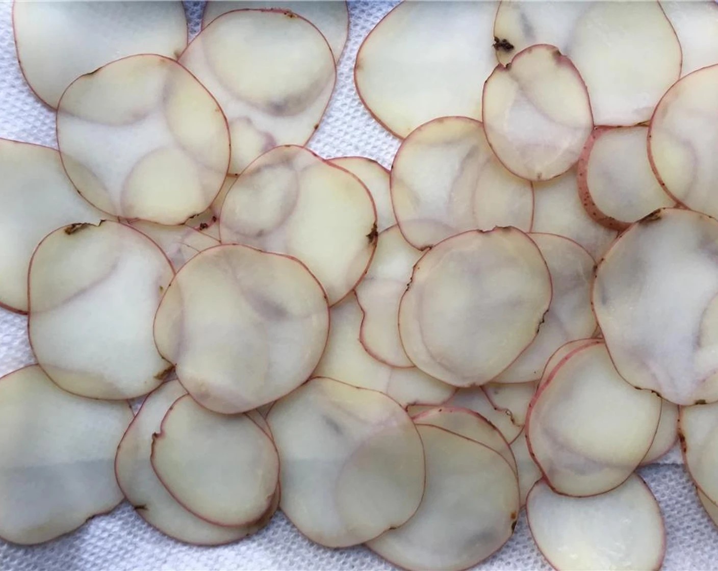 step 5 Using a mandoline or knife, very thinly slice the Baby Red Potato (1).