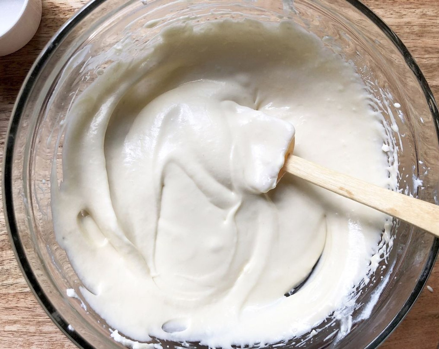 step 4 In a medium mixing bowl beat Cream Cheese (1/2 cup) with a mixer on medium speed until smooth. Add Granulated Sugar (1/4 cup), yolk of the Egg (1), and Pure Vanilla Extract (1/2 Tbsp). Beat until combined.