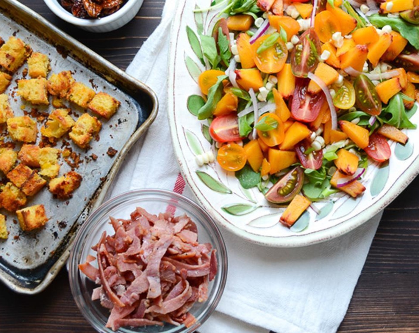 step 9 Sprinkle with peach, Cherry Tomato (1 cup), Country Ham Slices (8 oz), and Candied Pecans (1/2 cup). Top with croutons.