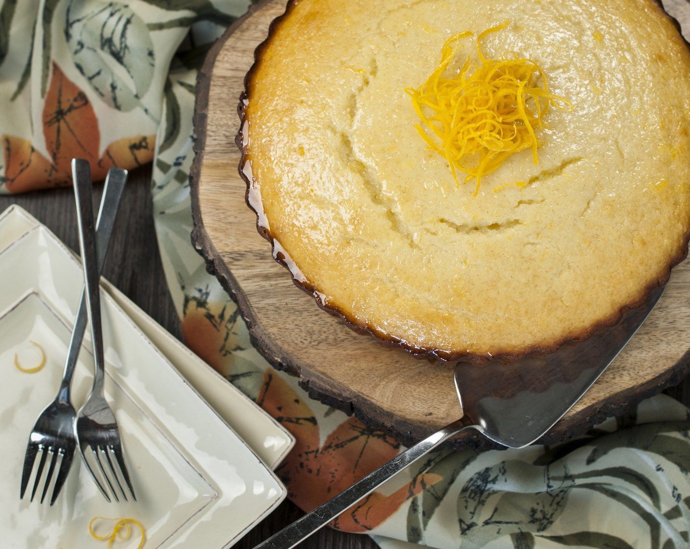 step 8 While cake is hot, brush with orange syrup allowing syrup to be absorbed before brushing on more.