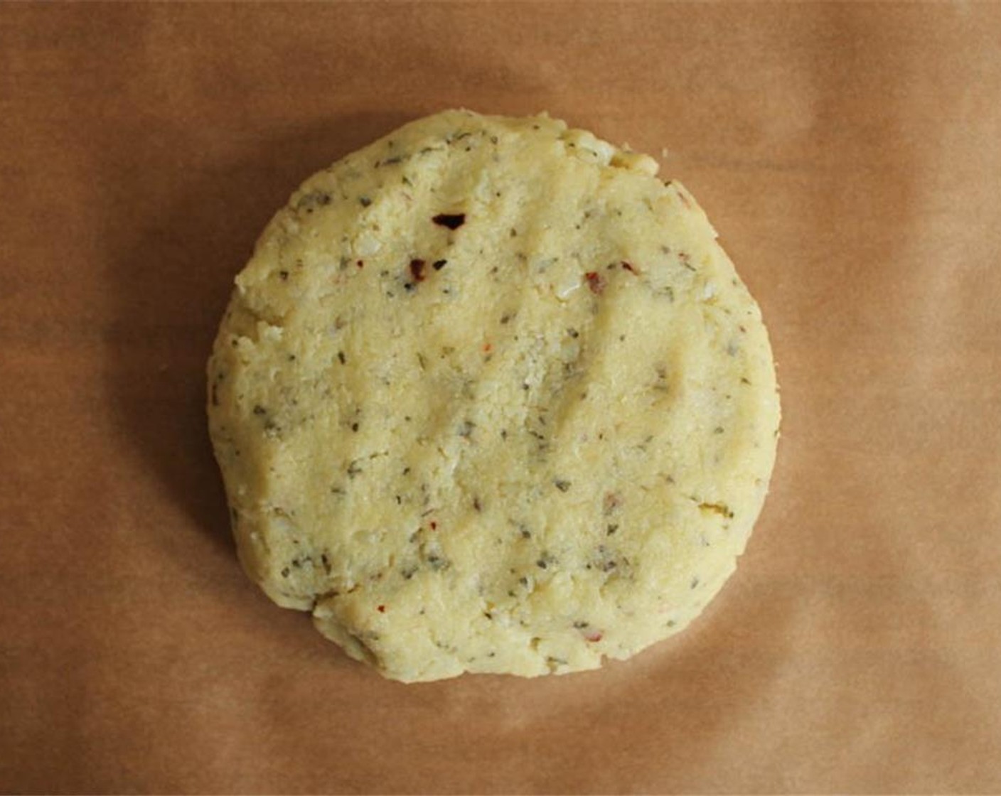 step 8 Form the dough into a ball and place it on the parchment-lined pizza peel or cutting board.