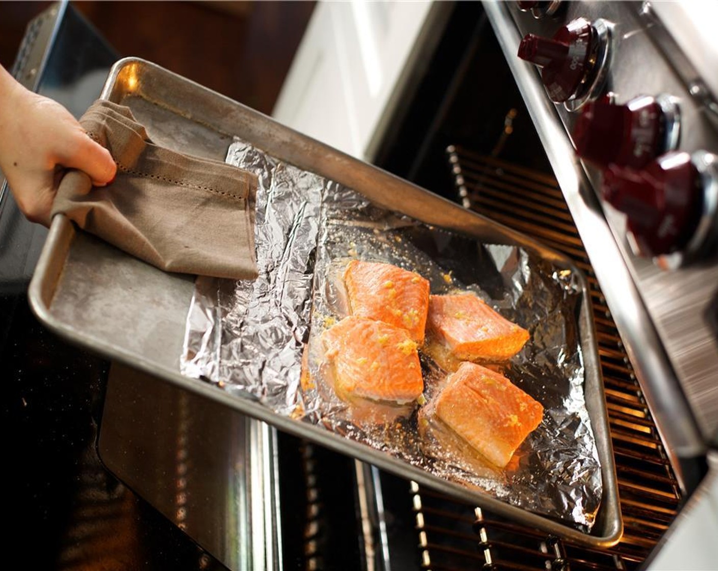 step 13 Pat the Trout Fillets (2) dry with paper towels and cut the fillets in half across. Place the fillets on the foil lined sheet pan and drizzle trout with Olive Oil (1/2 tsp). Season with Salt (1/2 tsp) and the lemon zest. Place in the oven and roast for nine minutes.
