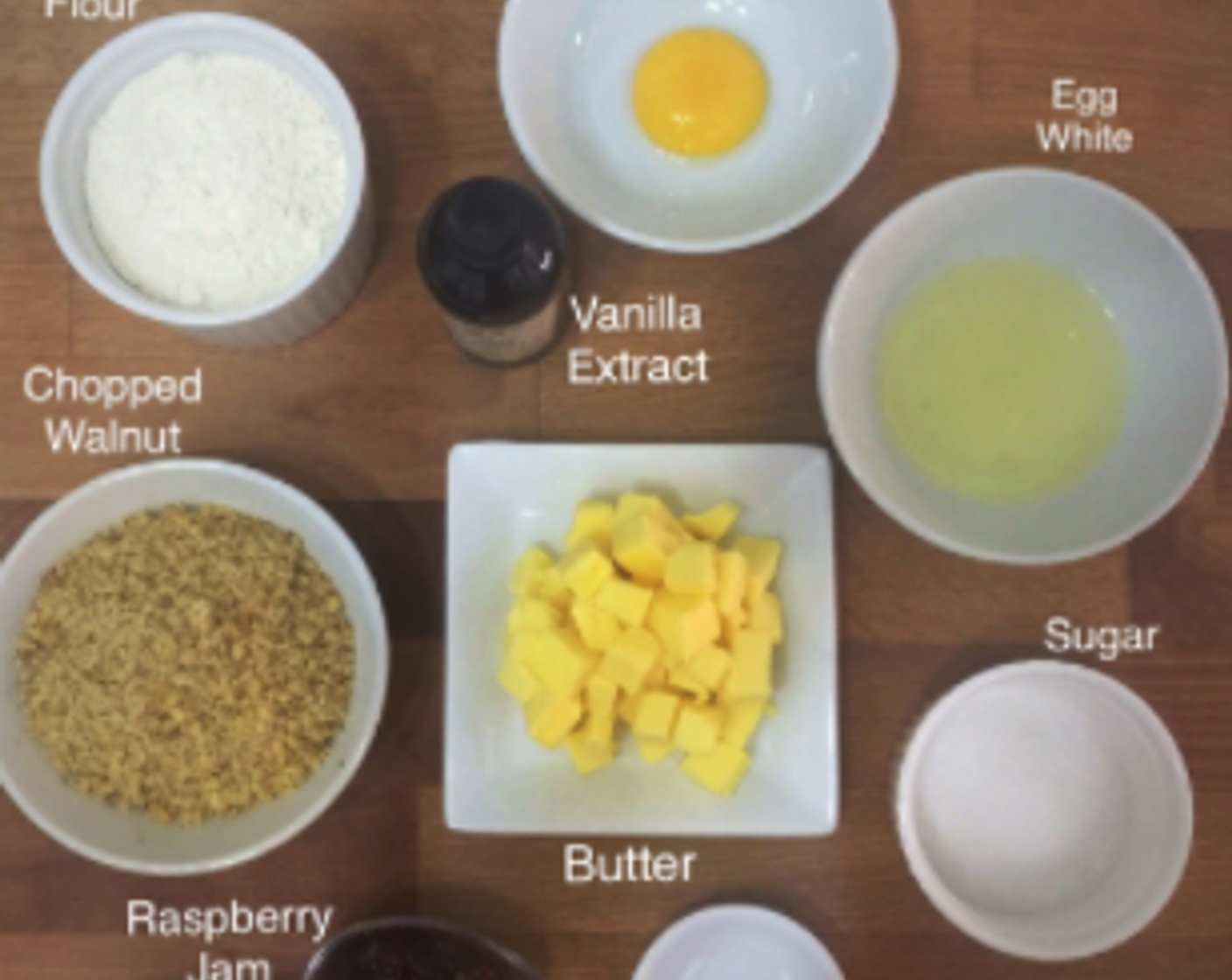 step 1 Start by preparing and weighing all the ingredients needed including All-Purpose Flour (1 cup), Eggland's Best Classic Egg (1), Vanilla Extract (1/2 tsp), Walnut (2/3 cup), Butter (4 oz) , Raspberry Jam (4 Tbsp), Salt (1/8 tsp) and Granulated Sugar (4 Tbsp).