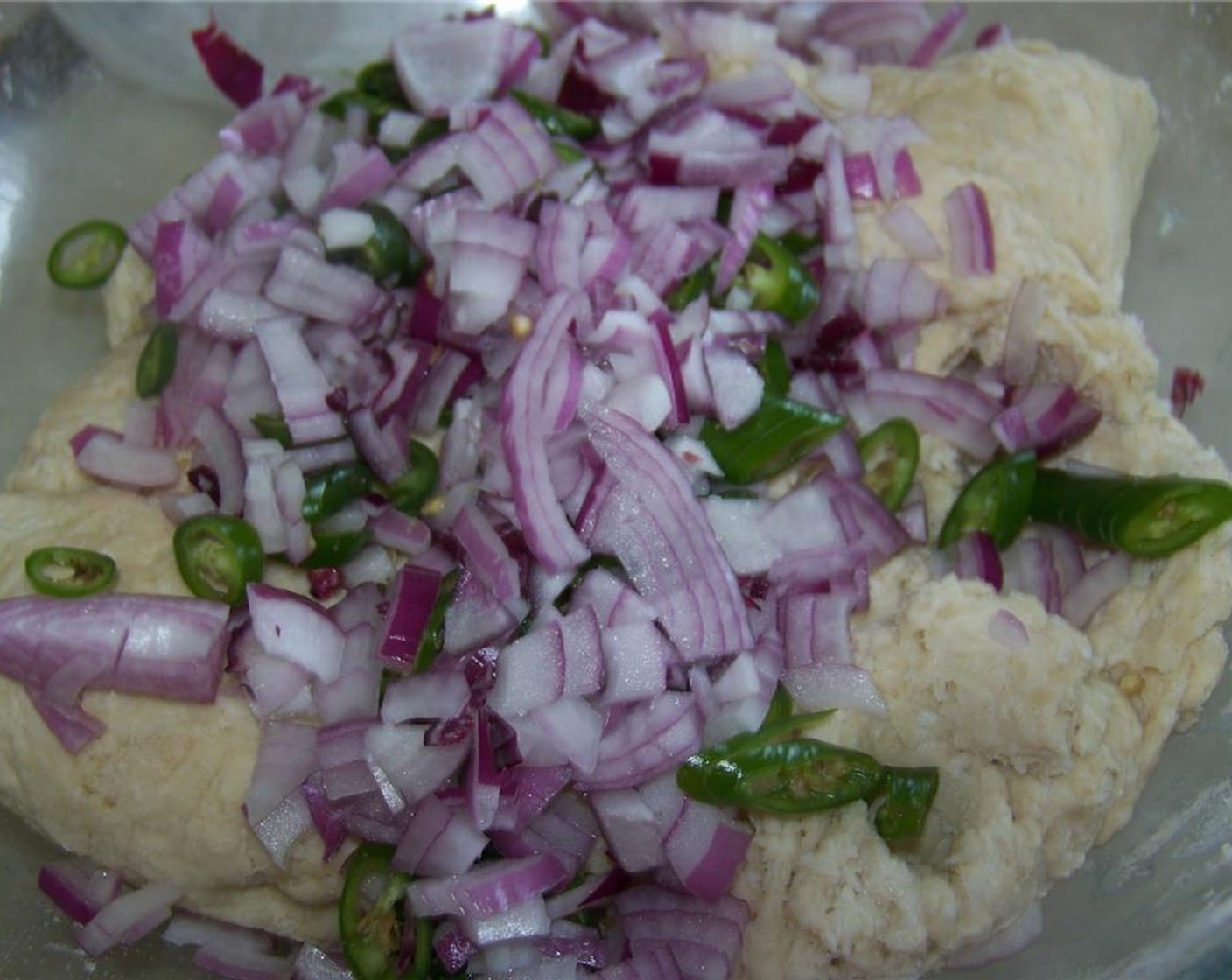 step 3 Add the Onion (1/4) and Chili Pepper (1/4 cup) to the dough.