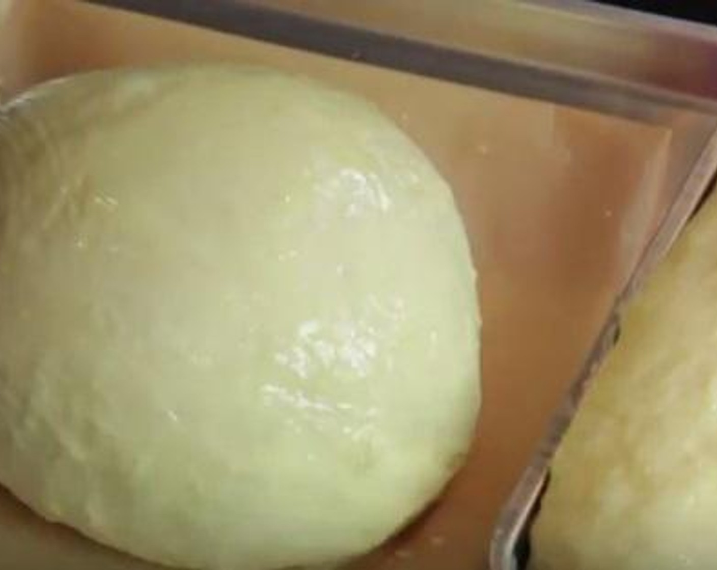 step 4 Roll out into a desired shape. I bake in a bread sandwich loaf pan. Roll out to fit into the pan. Butter pan really well, place in the pan and brush top with Butter (2 Tbsp) cover with a light soft cloth.