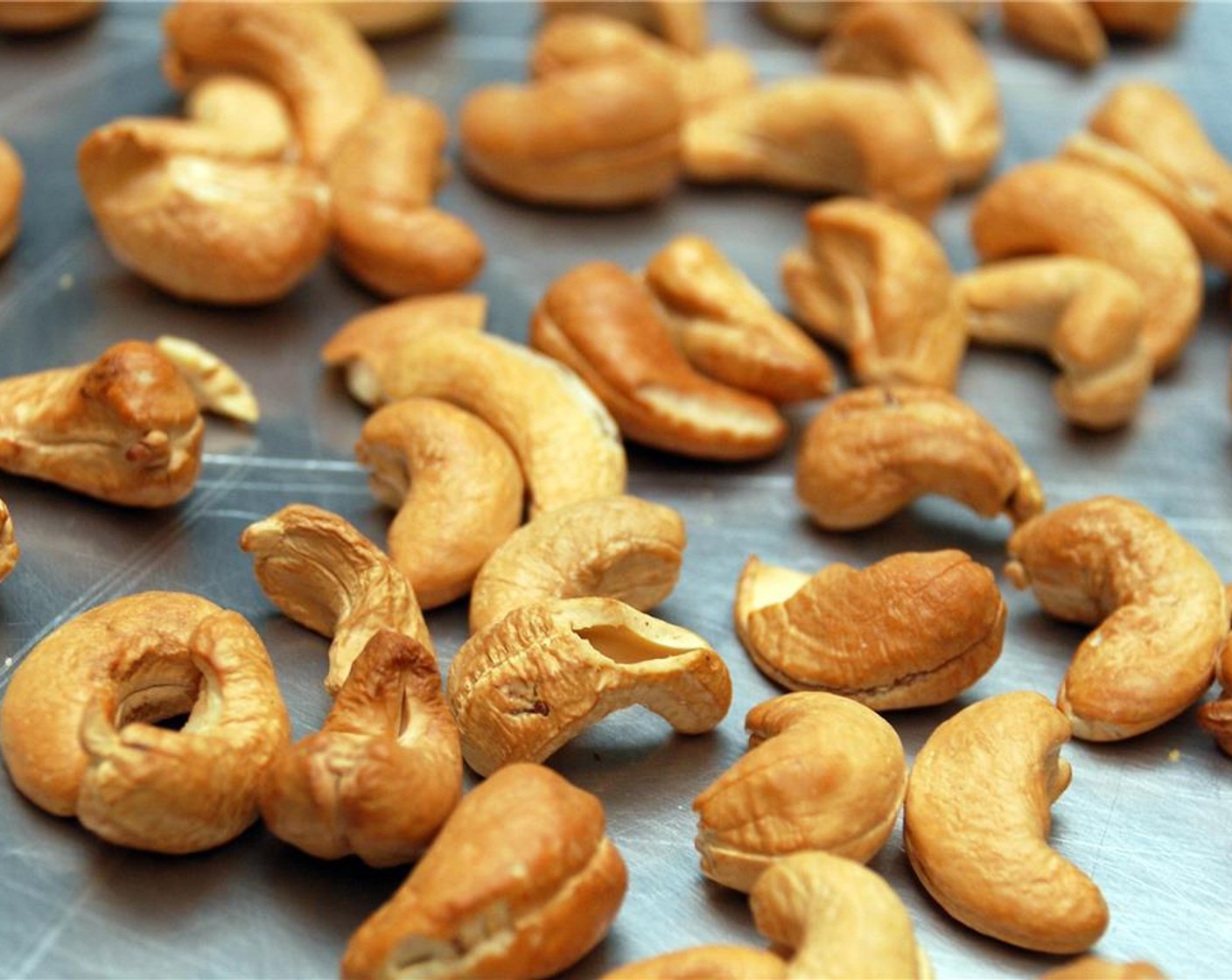 step 5 Scatter the Cashew Nuts (2/3 cup) on a baking tray, and place in the oven to toast for around 8 minutes or until slightly browned. Remove from the oven and place aside to cool.