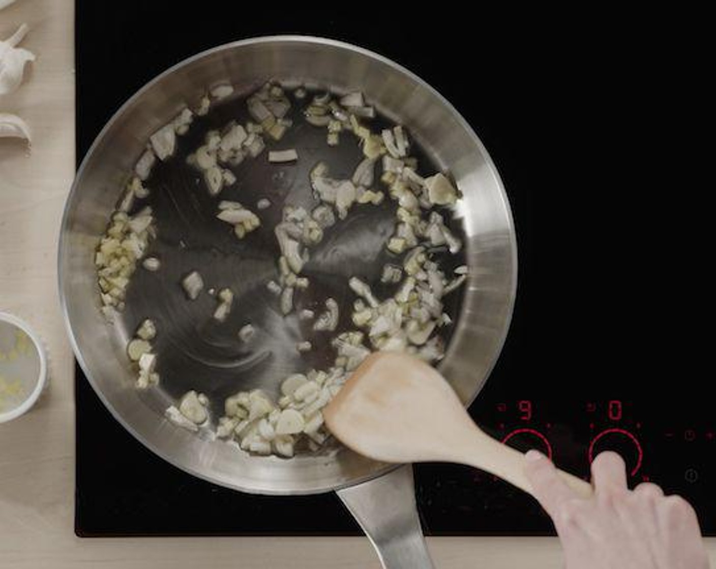 step 2 Start by frying the Garlic (3 cloves) and Fresh Ginger (2 in) with Cooking Oil (1 tsp). Induction heats up your pan almost immediately so you can start cooking right away.