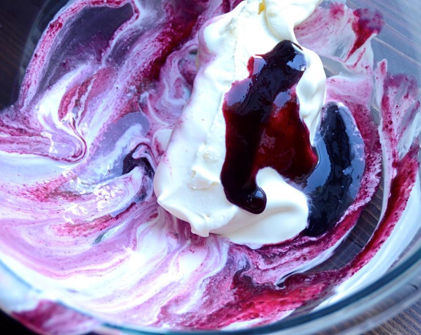 step 12 Scoop out one quarter of the ice cream and add 2-3 tablespoons of blueberry puree. Use a spatula to fold the puree into the ice cream. One or two turns with the spatula is all you want -- so you get pretty swirls. If you work it too much -- the whole thing will turn purple.