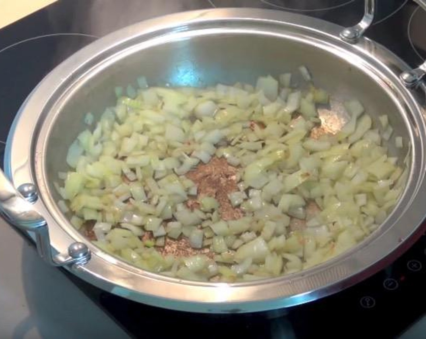 step 2 Into the same pan, add Yellow Onions (2). Cook over a medium heat for 3-4 minutes, or until onions have softened.