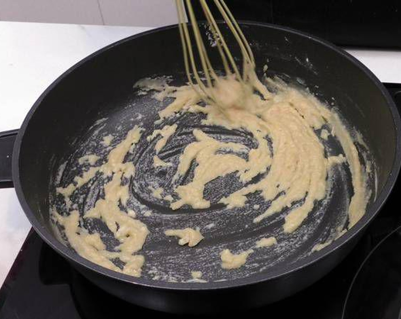 step 1 We start by making the béchamel sauce. In a pan on medium heat add the Butter (1/4 cup). Once melted add the All-Purpose Flour (1/2 cup) and mix thoroughly with butter.