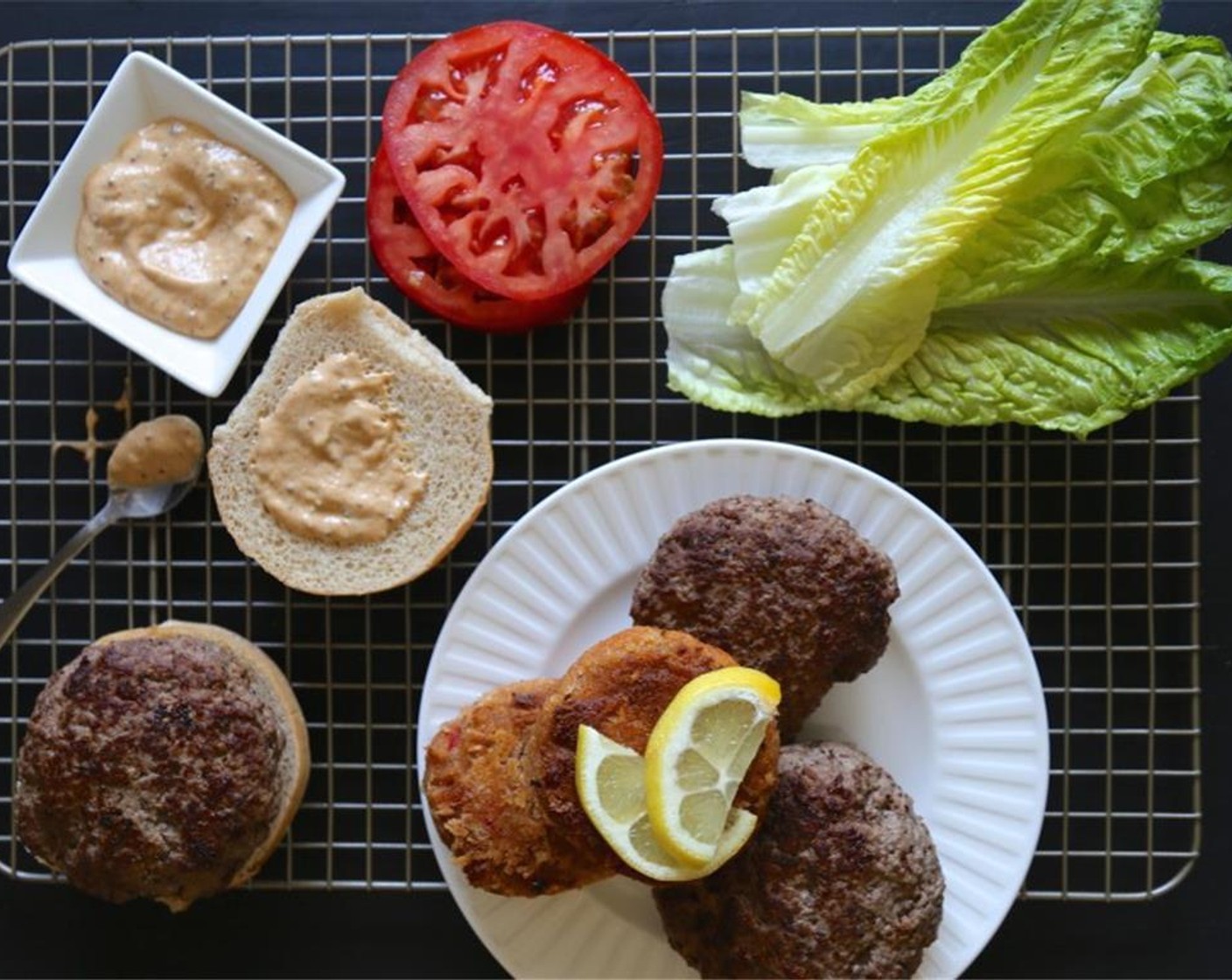 step 9 In a large bowl, combine Ground Beef (1.5 lb), Tabasco® Original Red Pepper Sauce (1 tsp), Salt (to taste), and Ground Black Pepper (to taste). Form beef into two large patties.