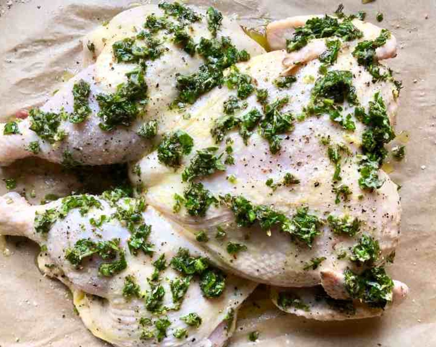 step 4 Transfer half of the lemon herb sauce to a small serving bowl and set aside. Spread the rest of the sauce over both sides of the chicken.