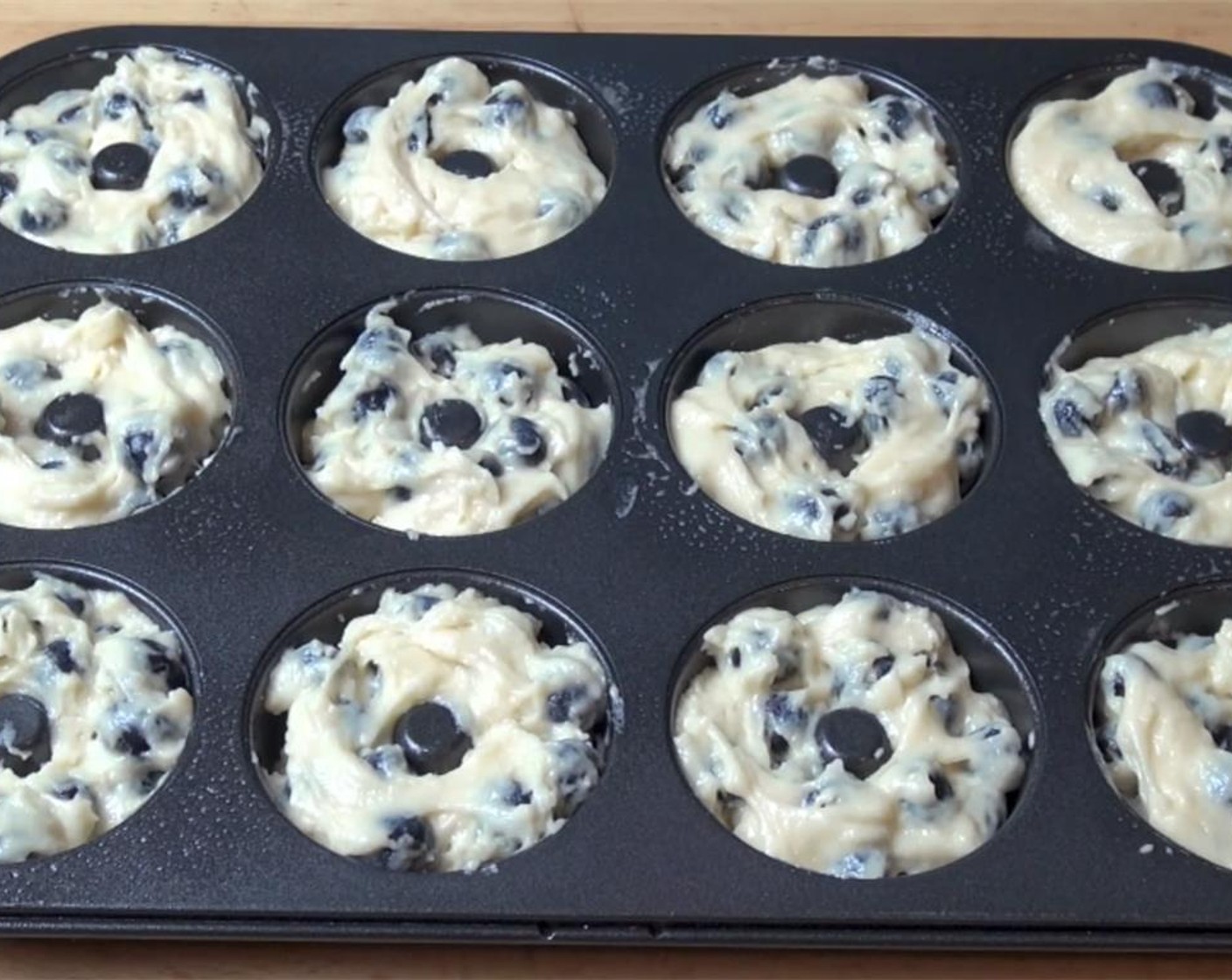 step 5 Grease your donut pan with spray on oil and fill with batter until 2/3 full. Bake for 10 to 12 minutes or until golden brown.