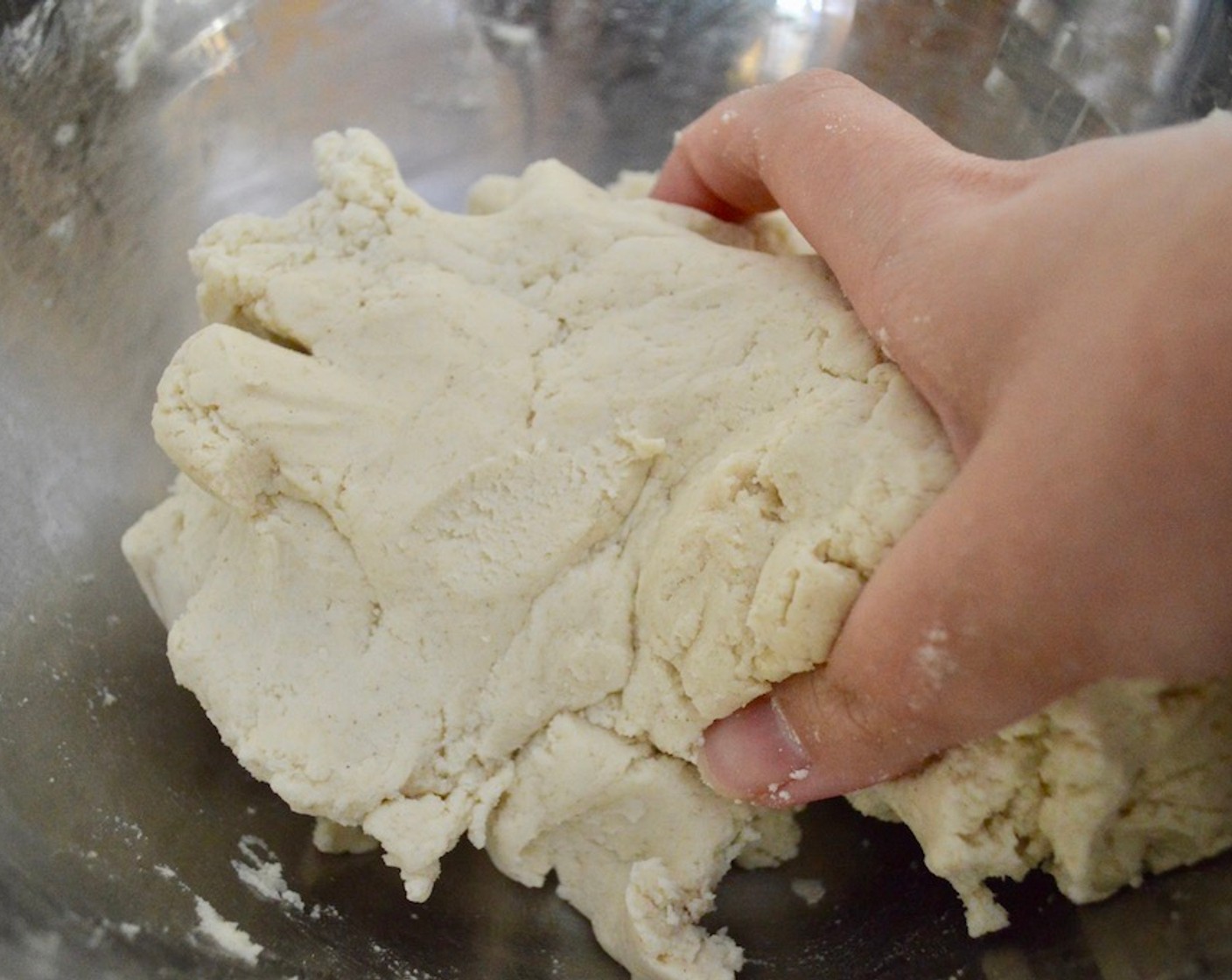 step 12 Put together the simple masa dough. Combine the Maseca Instant Corn Masa Mix (6 cups), and Salt (1 tsp) in a large bowl. Then start by pouring the Water (5 1/2 cups) in. With clean hands, work it all together into a dough. If it is still a little crumbly, add more water gradually and keep working it until it is a soft, slightly wet dough.