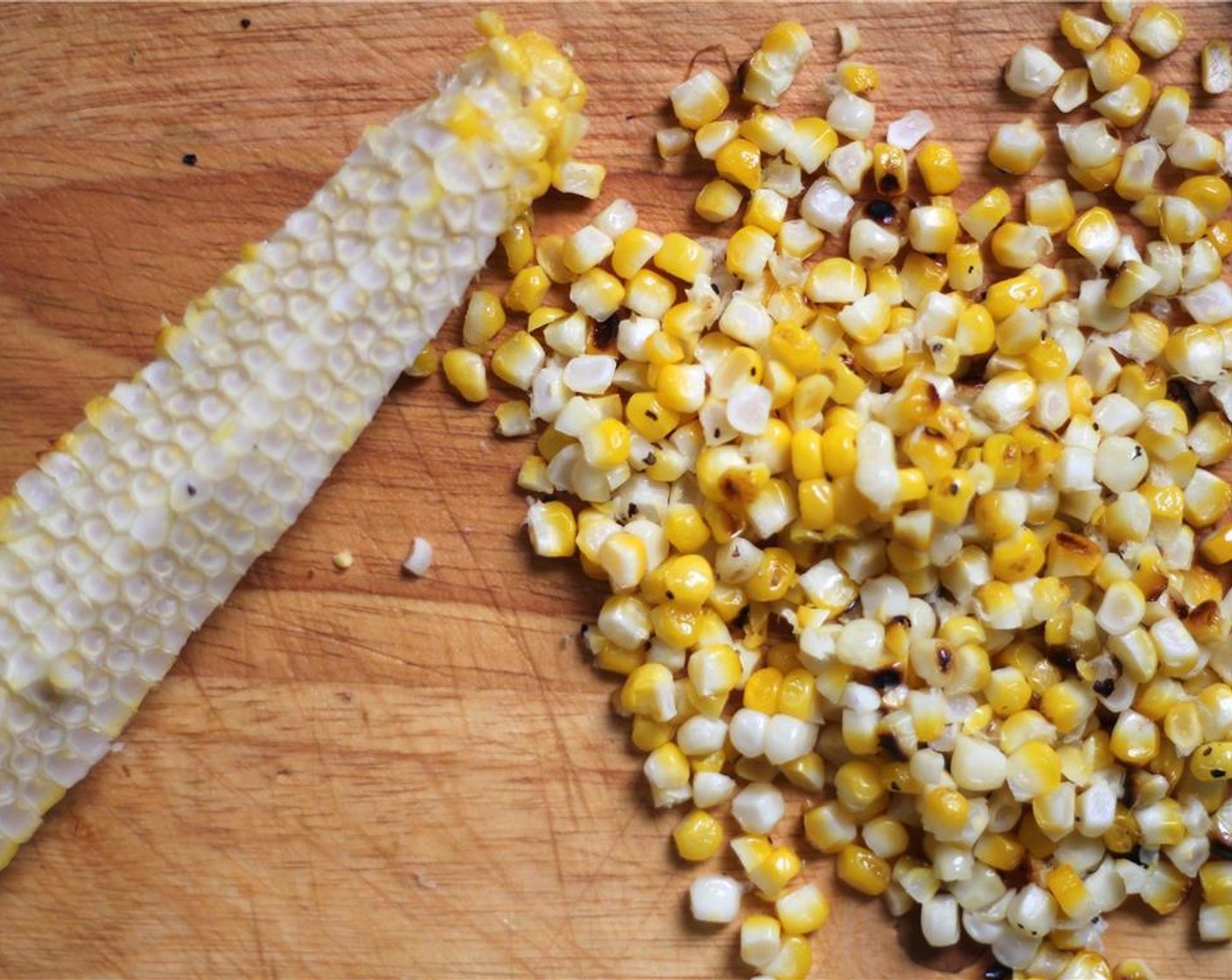 step 4 When the corn is cool enough to handle, slowly cut the kernels off the cob over a large bowl or cutting board.  Be warned that kernels will want to fly, so cut slowly.  Combine roasted kernels with the other chopped vegetables and Ground Cumin (1/4 tsp), Ground Coriander (1/4 tsp), and Cayenne Pepper (1/4 tsp).