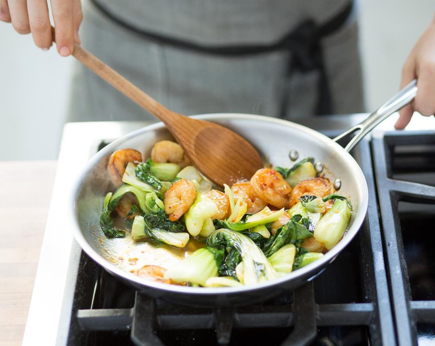 step 7 In the center of two bowls, place the jasmine rice. Top with the Sweet Chili Shrimp and baby bok choy. Serve and enjoy!