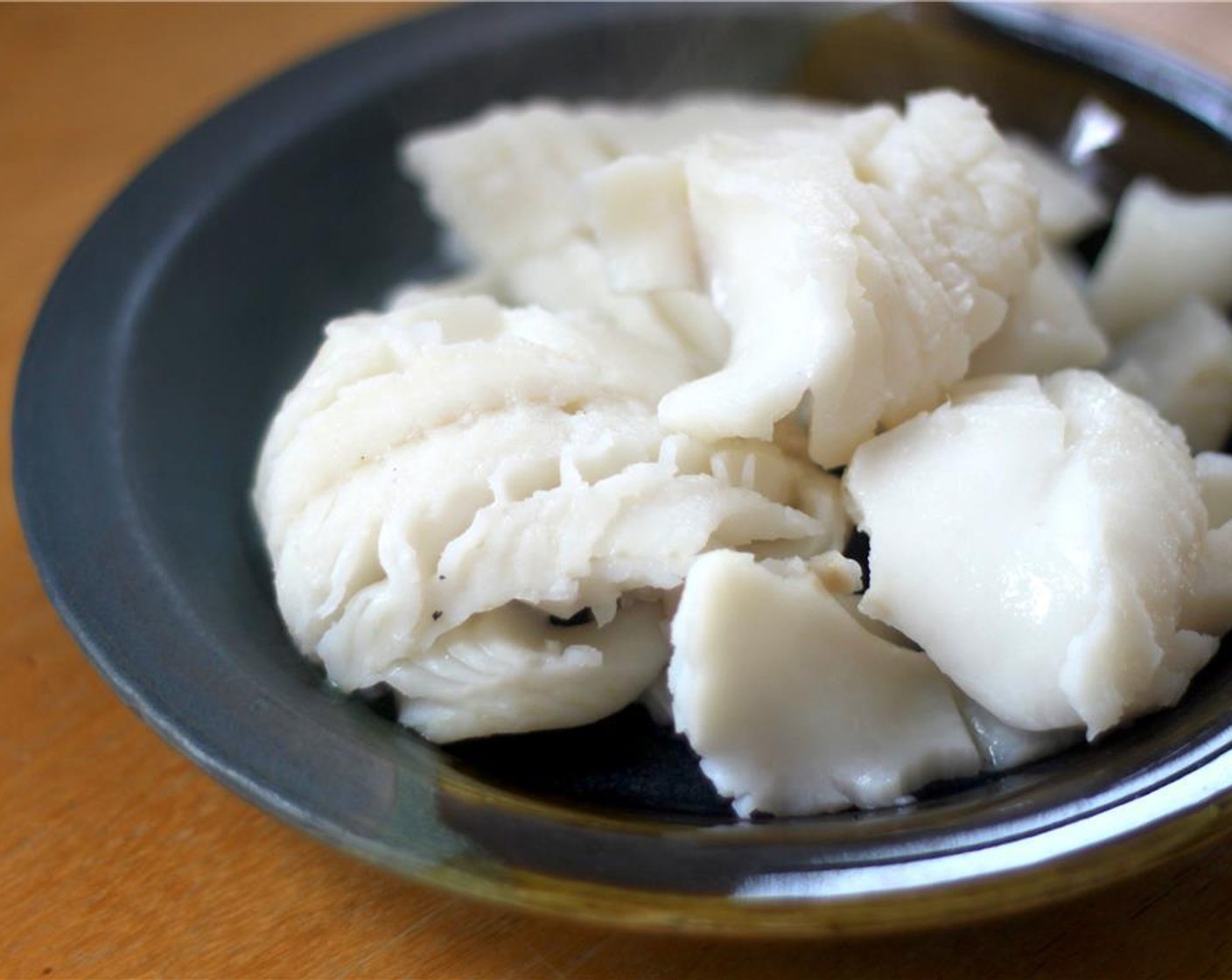 step 5 When the water is boiling, drop in your Cod Fillets (2) to poach for about 4 minutes, or longer if you have large pieces.  You'll know when it's done when the fish is delicate and flaky.