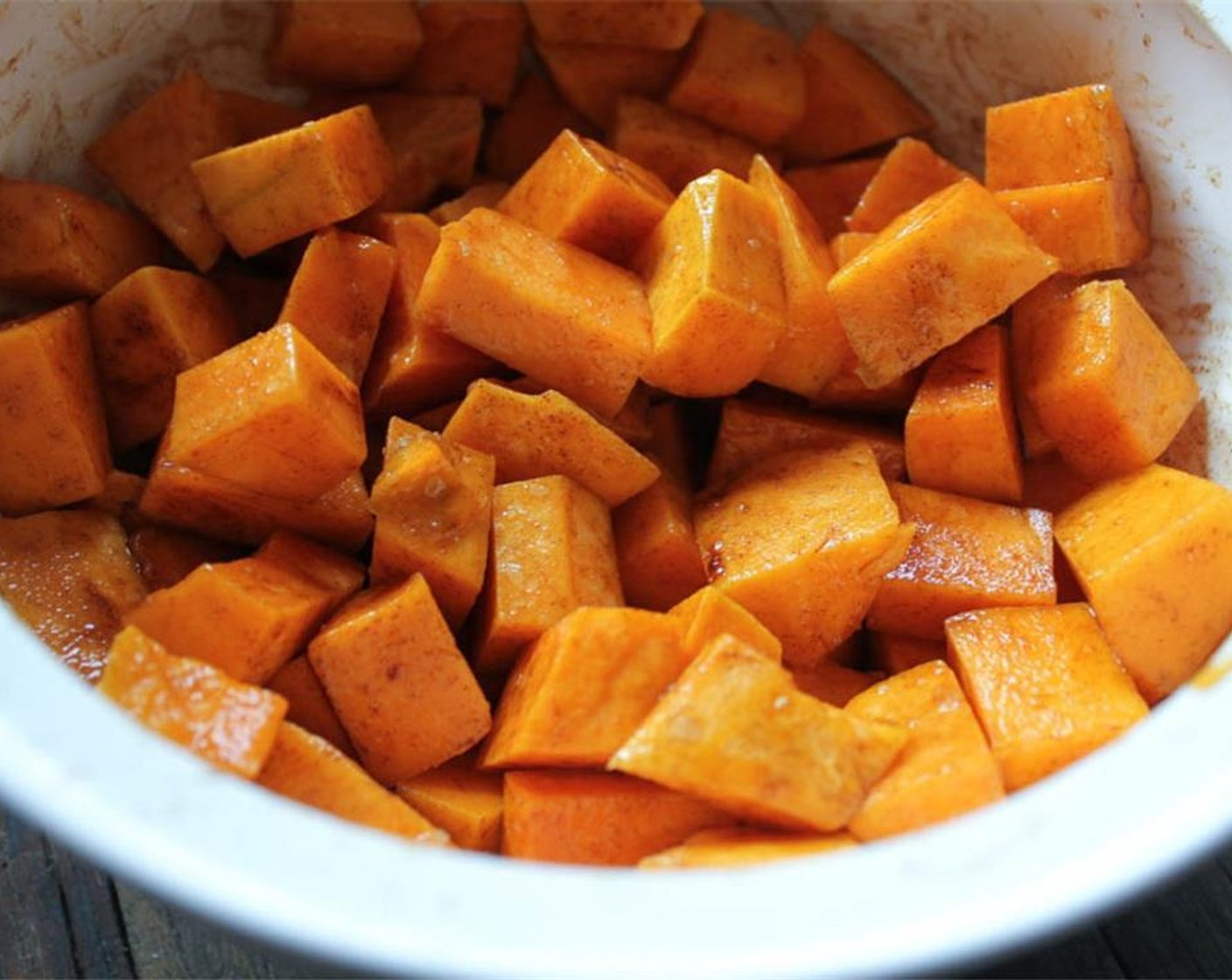 step 7 Line a baking sheet with parchment or tinfoil and spray it with cooking spray. Briefly set aside. Place the cubed butternut squash in a medium bowl. Add 1 tablespoon of Olive Oil (1 Tbsp) and the Ground Cinnamon (1/2 tsp) and toss to coat.
