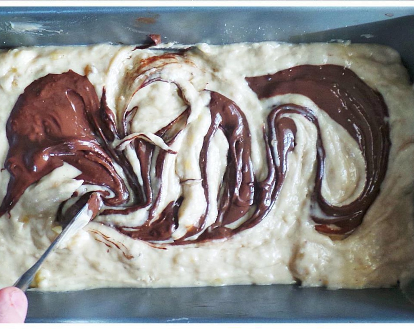 step 6 Swirl semi-sweet chocolate into bread and then bake 45-50 minutes until an inserted toothpick comes out clean.