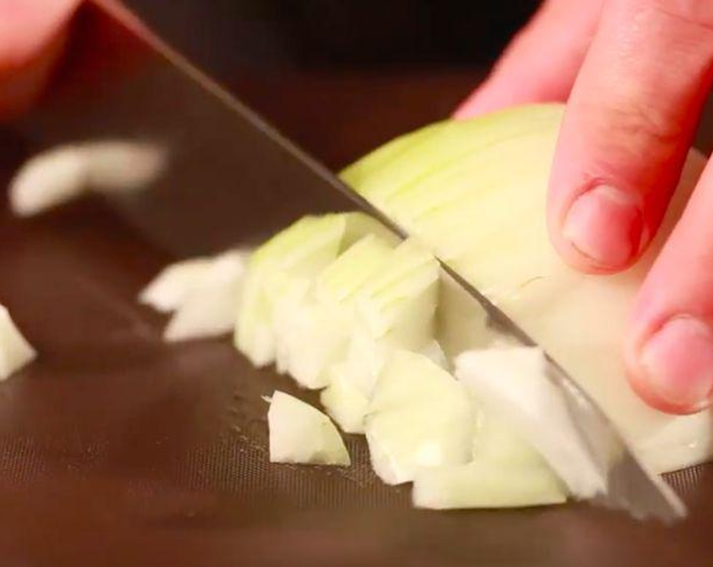 step 4 Roughly chop the Yellow Onions (2). Set half aside for later use.