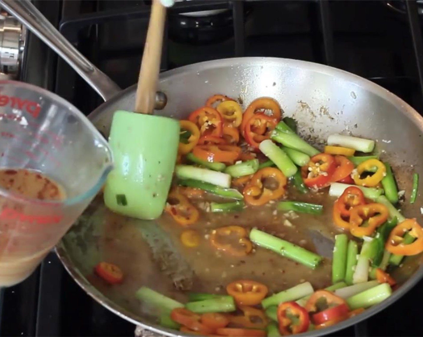 step 10 Whisk the sauce one more time, and add it to the pan. Cook the sauce, while scraping the bottom of the pan with a wooden spoon or spatula, to pick up the brown bits.