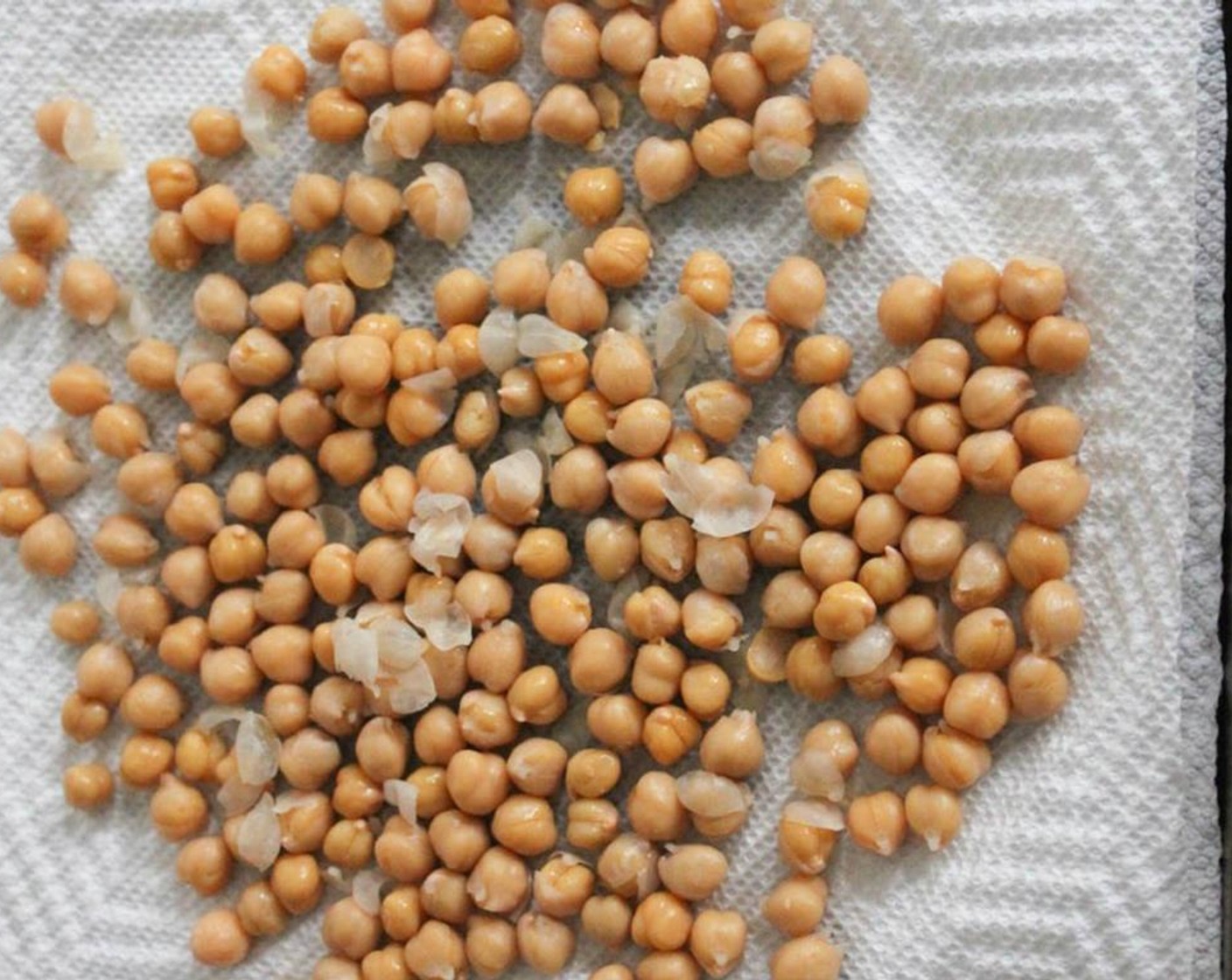 step 2 Drain and rinse the Chickpeas (1 can). Gently pat them dry. When you do this, you’ll notice that some of the 'skins' on the chickpeas will co.e loose. That’s a good thing. Just pick off the loose skins and discard them.