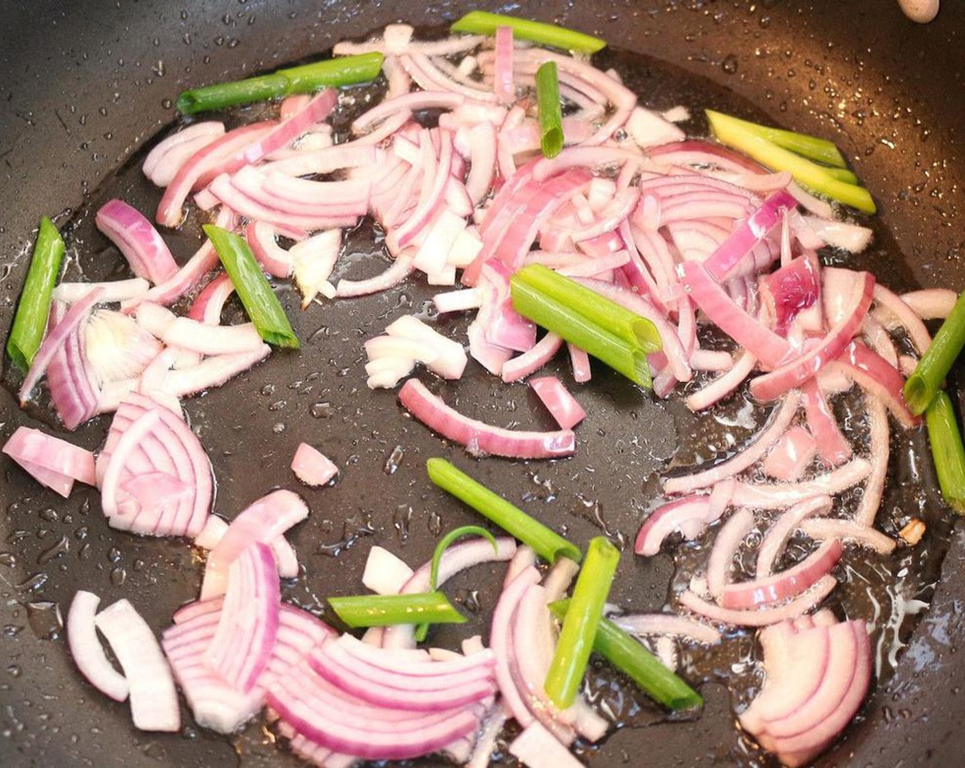 step 1 Saute Onion (1) and Scallion (1 bunch) in Ghee (2 Tbsp).