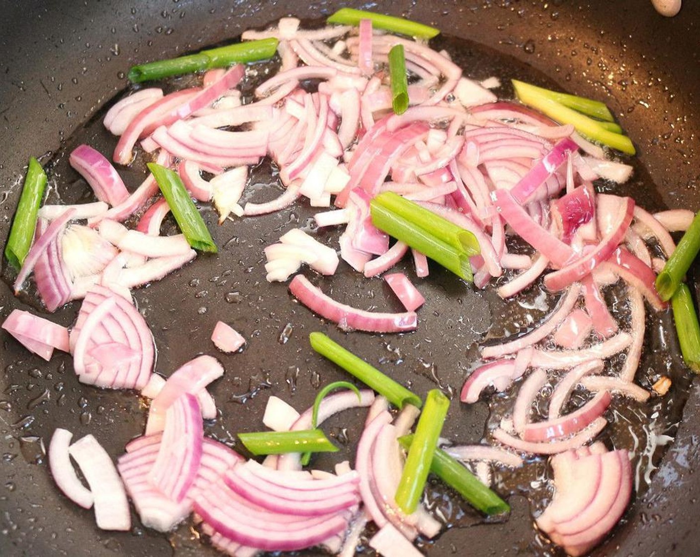 step 1 Saute Onion (1) and Scallion (1 bunch) in Ghee (2 Tbsp).