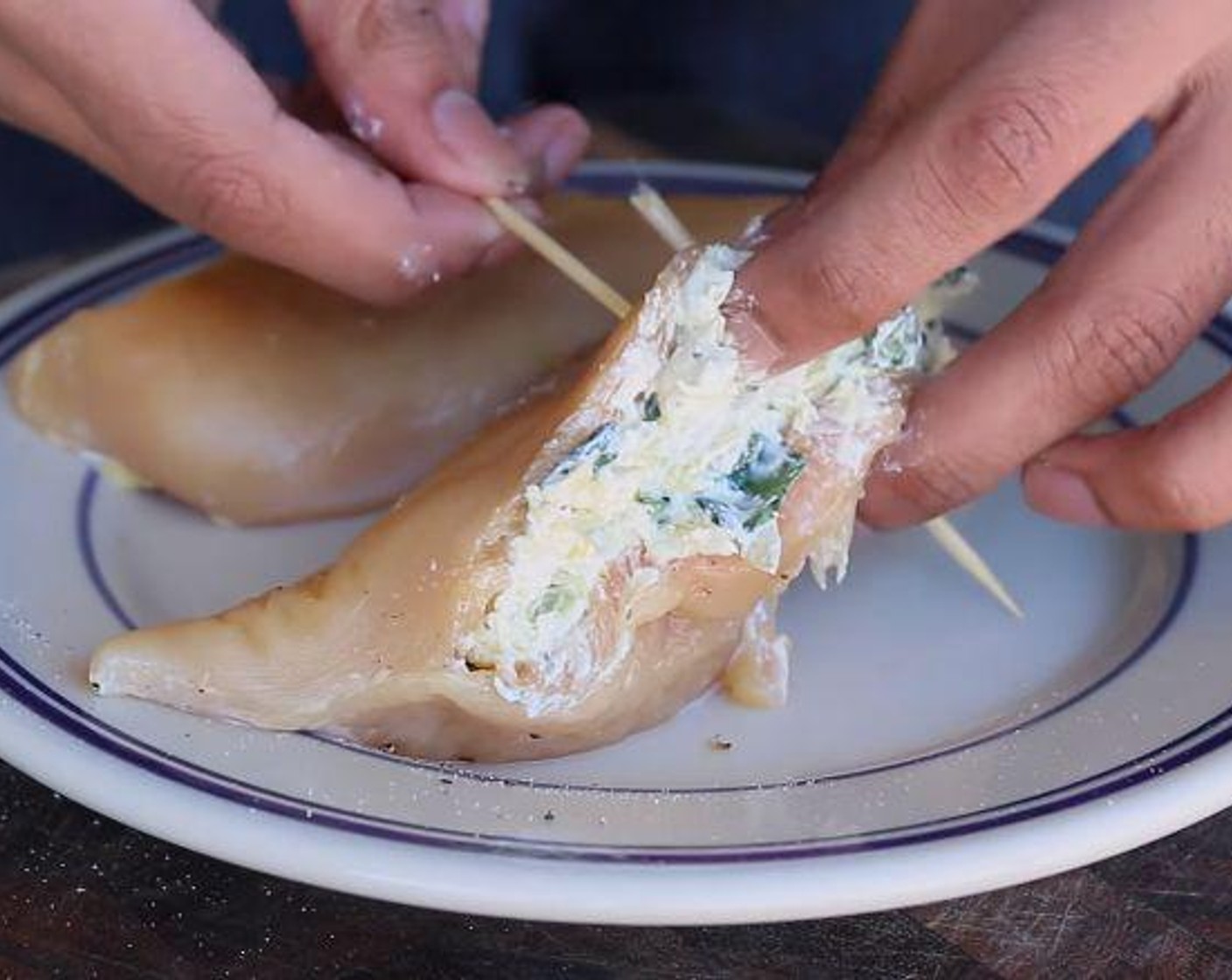 step 3 Make a pocket in each Boneless, Skinless Chicken Breasts (3). Season, inside the pocket and outside with Salt (to taste) and Ground Black Pepper (to taste). Fill each pockets with mixture and seal each breast with few toothpicks.