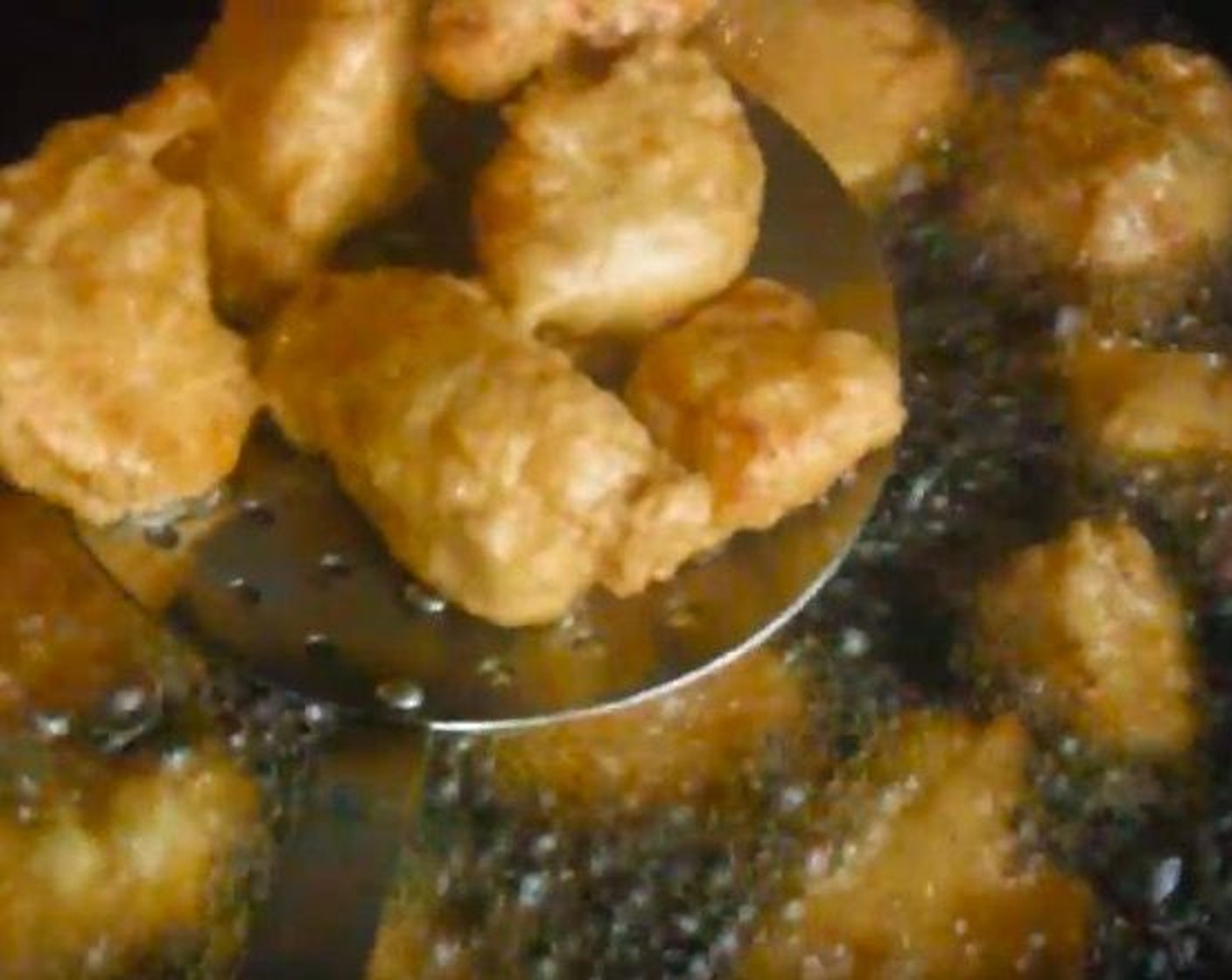step 5 In a frying pan, heat up Cooking Oil (as needed). When oil is hot, add chicken and fry until golden brown. Remove with a slotted spoon and drain excess oil on a paper towel.