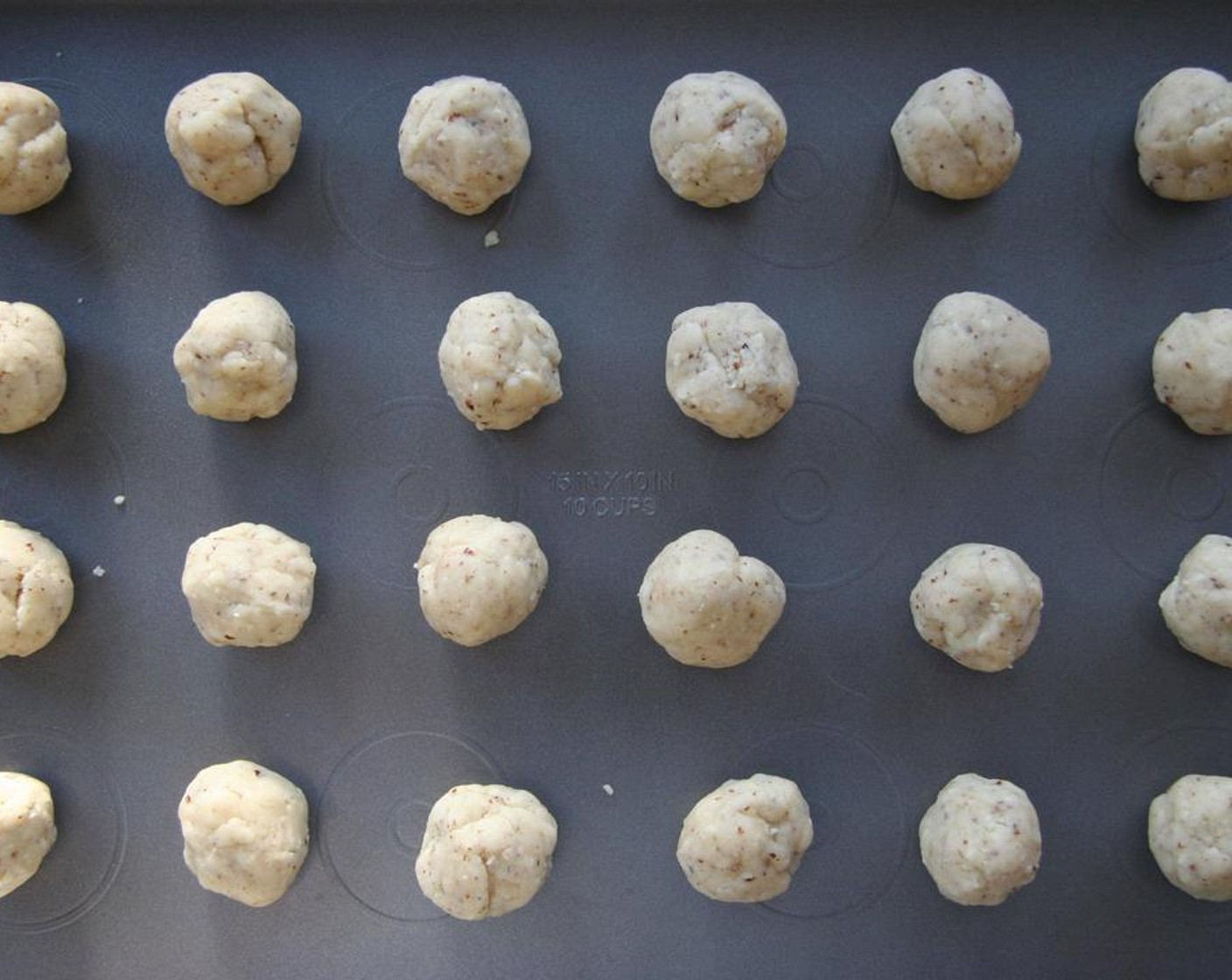 step 4 Shape dough into 1-inch balls. Place about an inch apart on a cookie sheet.