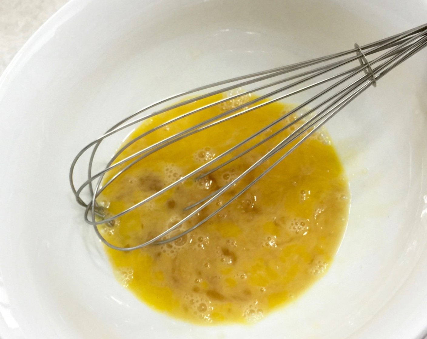step 12 In a medium size bowl, briefly beat Farmhouse Eggs® Large Brown Eggs (2) with Vanilla Extract (1 tsp).