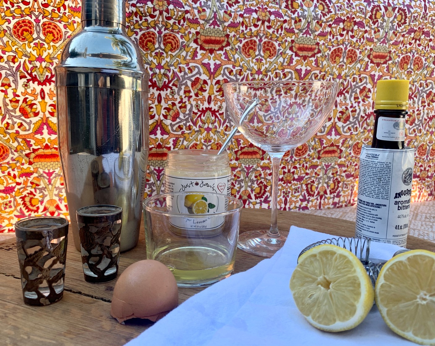 step 1 In a cocktail shaker, add the Egg White (1), Pisco (2.5 fl oz), Just Jan’s® Meyer Lemon Curd (1 Tbsp), and juice from Lemon (1). Shake vigorously so the egg white is foamy.