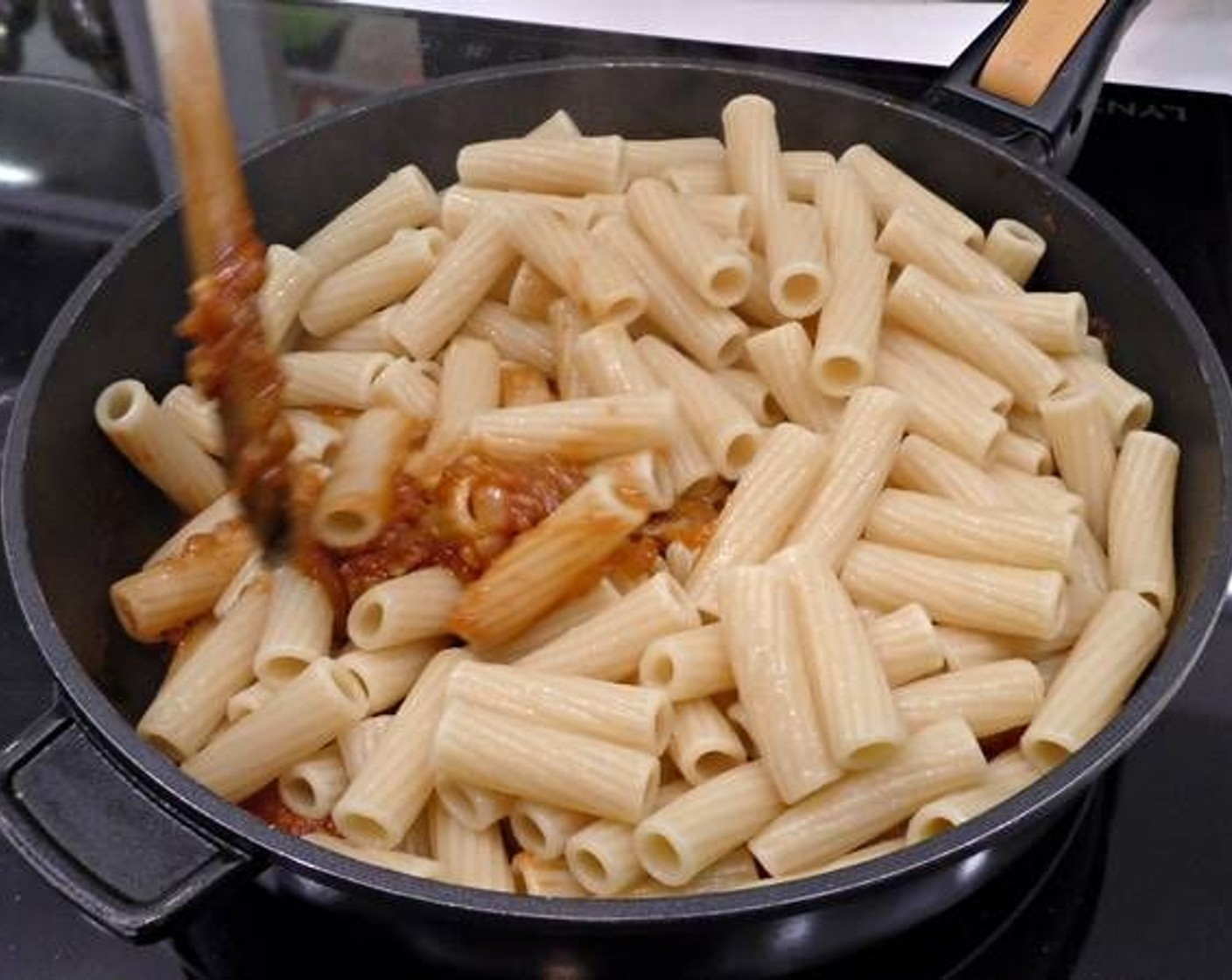 step 4 Once the pasta is cooked, add to the pan with the sauce and mix. Cook together for 2-3 minutes.