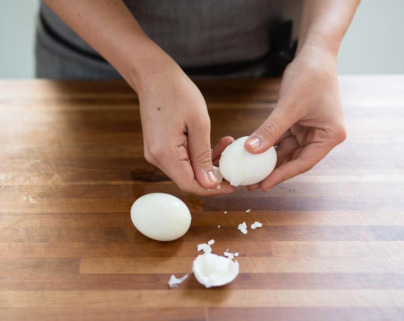 step 3 Peel the eggs; discard the shells. Slice the eggs in half and set aside.