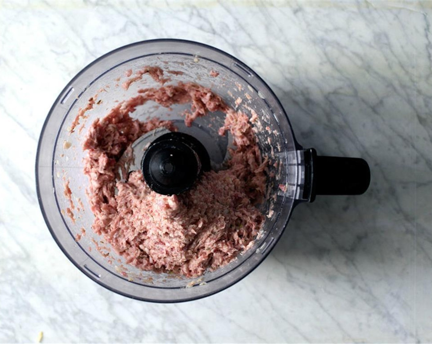 step 9 Add the cold fatty ground pork, Corn Starch (1 Tbsp), Salt (1/2 Tbsp), Maple Syrup (1/2 Tbsp), Fennel Seeds (1 tsp), Ground Black Pepper (1/2 tsp) and Ground White Pepper (1/4 tsp). Run food processor until evenly incorporated.