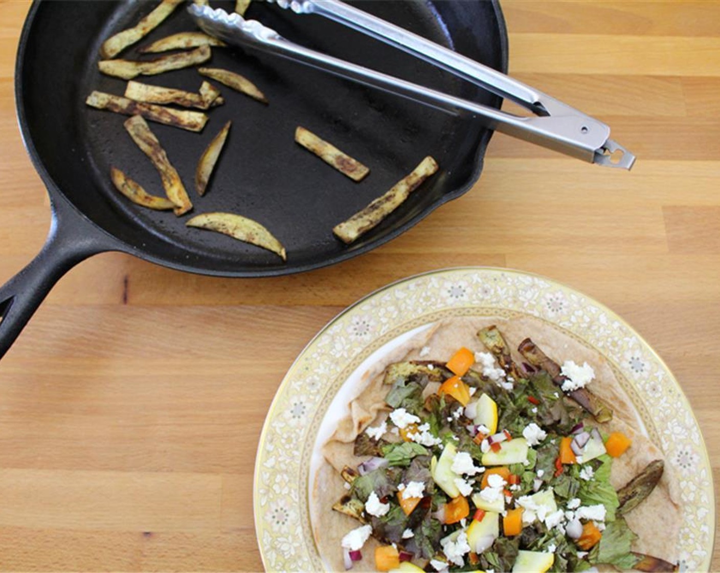 step 6 Top with eggplant, Lettuce (1 1/2 cups), summer squash, chopped bell pepper, diced red onion, chopped tomato, minced chili pepper and Feta Cheese (1/4 cup).