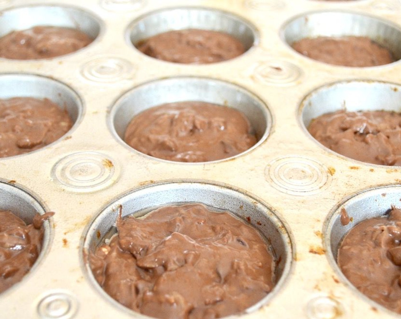 step 5 Evenly distribute the batter among the 12 muffin wells and bake them for 20-25 minutes, until a toothpick inserted in the center comes out cleanly.