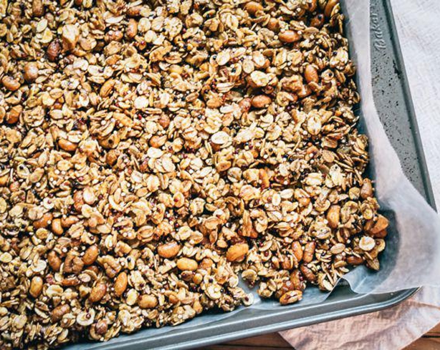 step 6 Line large baking sheet with wax paper and spread granola mixture evenly to create a fairly smooth layer.