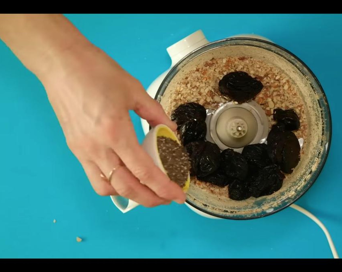 step 2 Add Prunes (1 cup), Chia Seeds (1 Tbsp), Orange (1 Tbsp), and Salt (1 pinch).