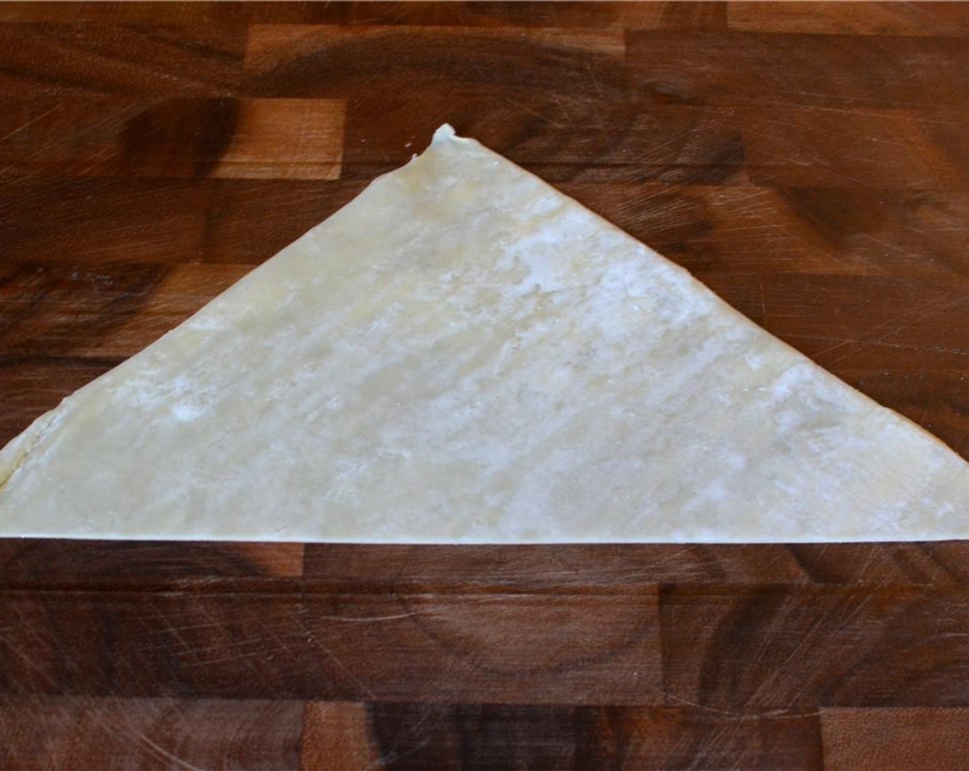step 8 Then cut it in half and repeat with the rest of the wrappers.