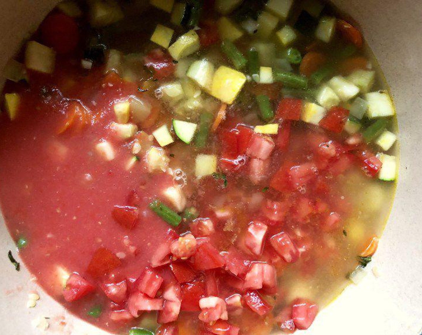 step 5 Add the tomato mixture to the pot and return the pot to the heat. Stir in the rest of the Plum Tomato (1 cup) and Chicken Broth (40 fl oz) along with the Kosher Salt (1 tsp) and Freshly Ground Black Pepper (1/2 tsp).