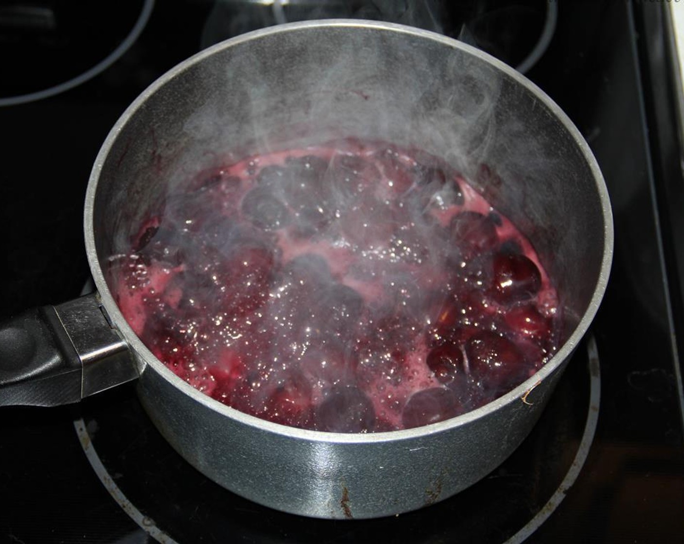 step 3 Pit the Cherries (4 cups) and place in a medium saucepan over medium heat. Bring to a boil.
