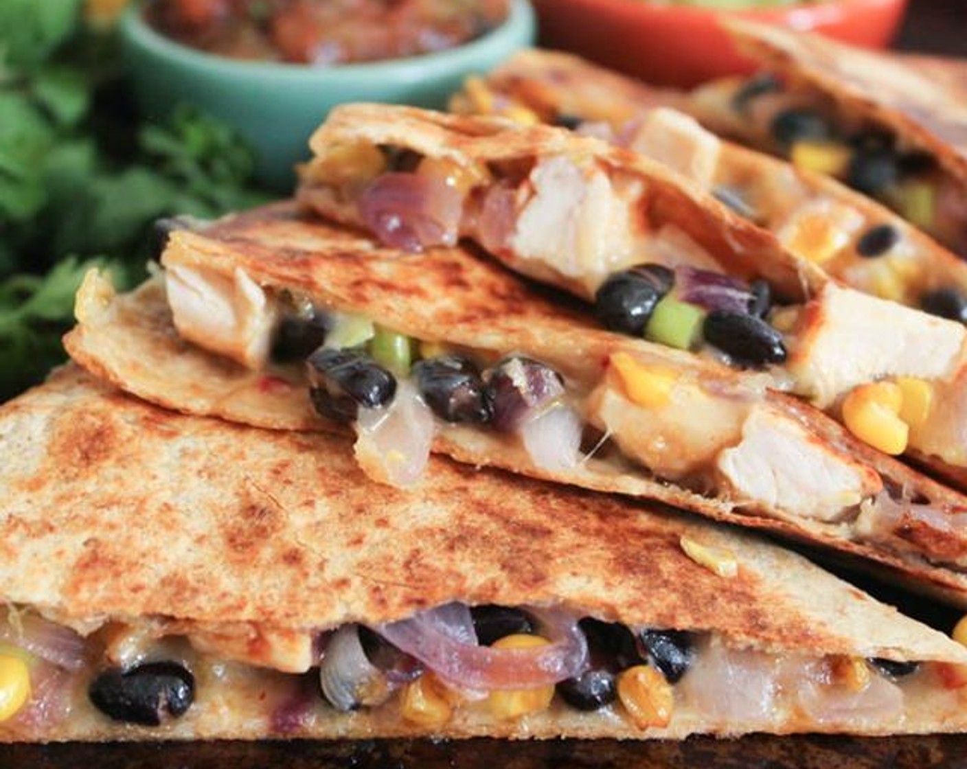 Spicy Chicken Quesadillas with Corn, Black Beans, and Caramelized Onions