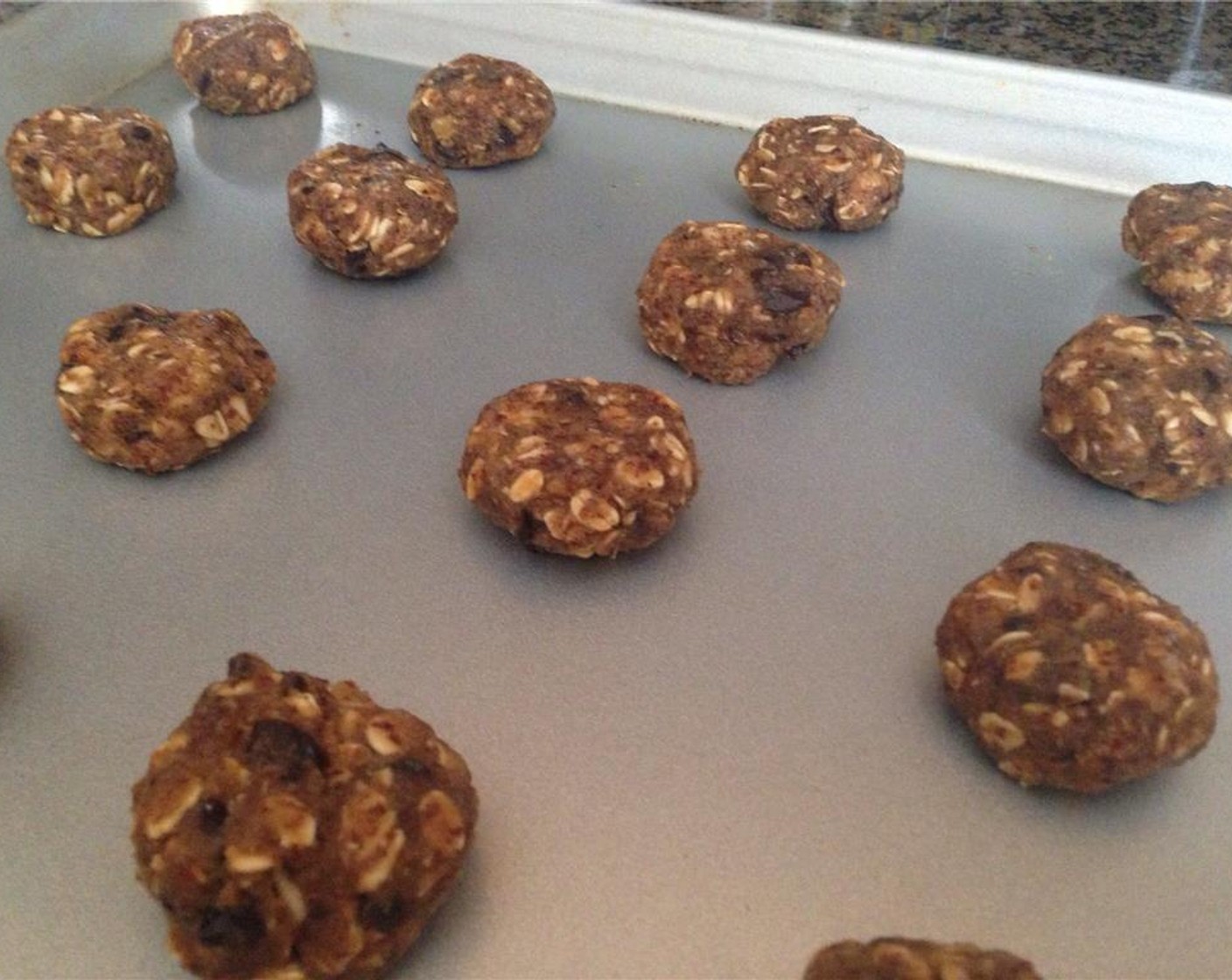 step 7 Shape the dough into 1-inch balls, place on baking sheet 1 1/2-inch apart. Press down slightly to flatten dough balls. Bake for 7-10 minutes. Remove from oven and put cookies onto a cooling tray.