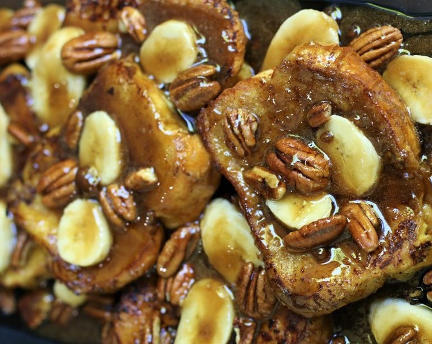 step 13 Remove warm French Toast from the oven and place it on a platter. Pour Bananas Foster Sauce on top and serve immediately! Optionally, serve with sweetened whipped cream or vanilla ice cream, or additional sliced bananas and pecans.